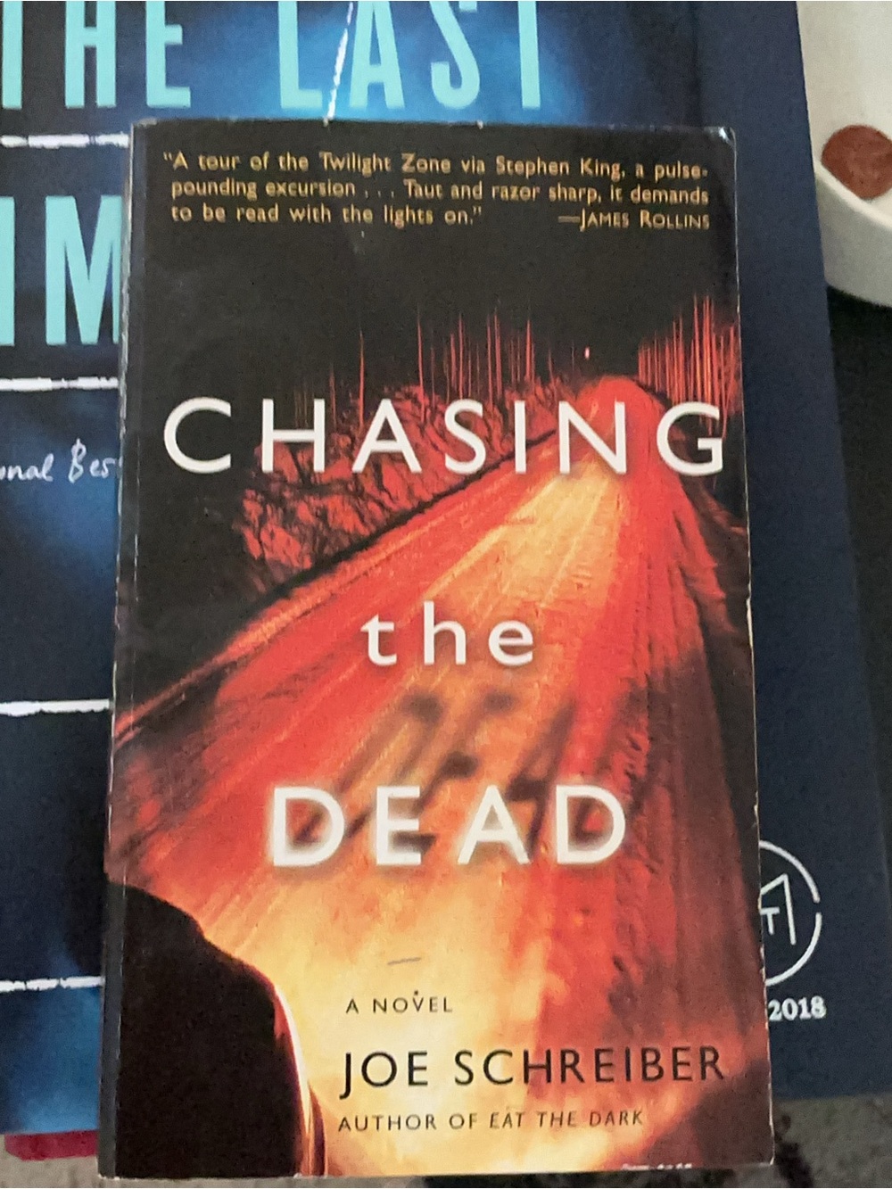 Hardcover Chasing the Dead by Joe Schreiber - Red/Orange Cover Novel